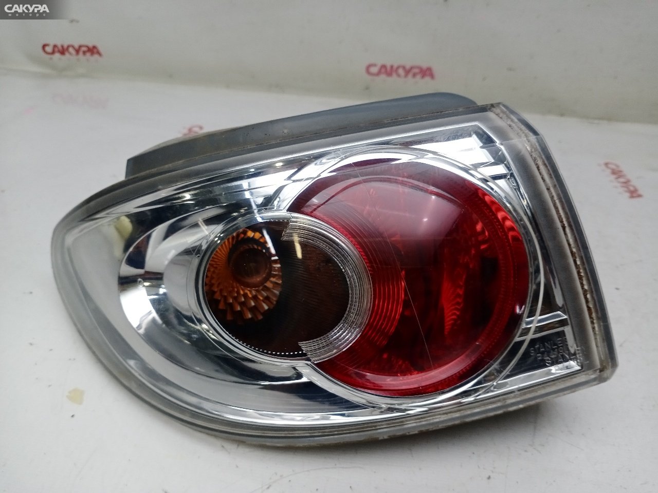 Фонарь стоп-сигнала левый Mazda Demio DY3W ZJ-VE P4419: купить в Сакура Красноярск.
