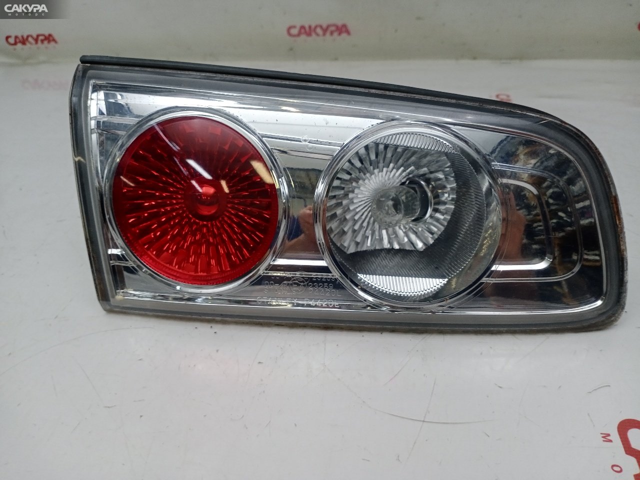 Фонарь вставка багажника левый Mazda Demio DY3W ZJ-VE P4420: купить в Сакура Красноярск.