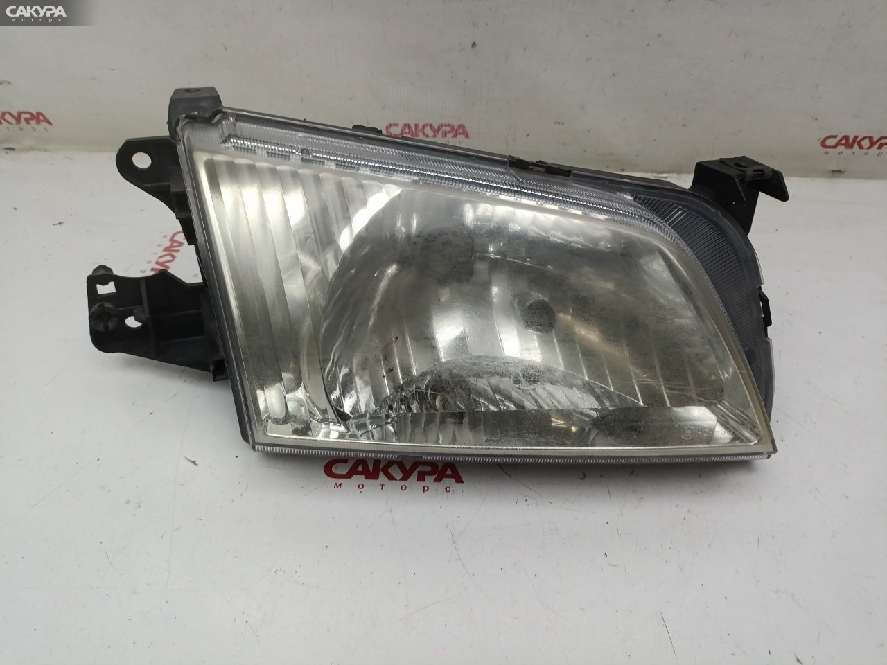 Фара правая Mazda Demio DW3W B3E P1001: купить в Сакура Красноярск.