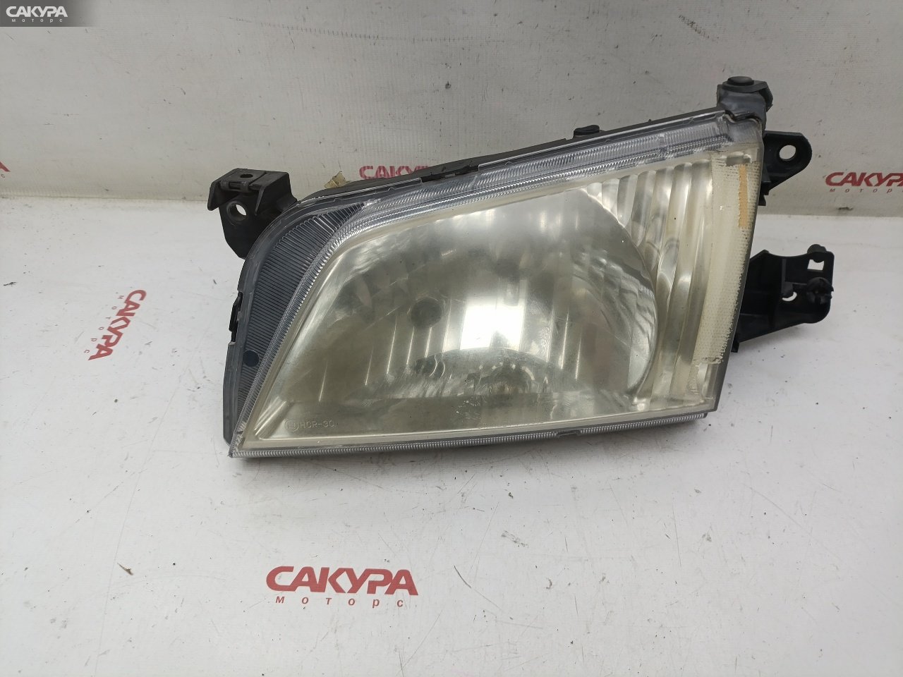 Фара левая Mazda Demio DW3W B3E P1001: купить в Сакура Красноярск.