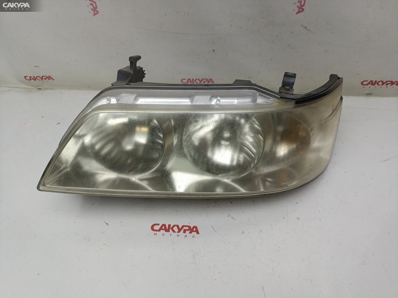 Фара левая Nissan Laurel HC35 RB20DE P0721: купить в Сакура Красноярск.