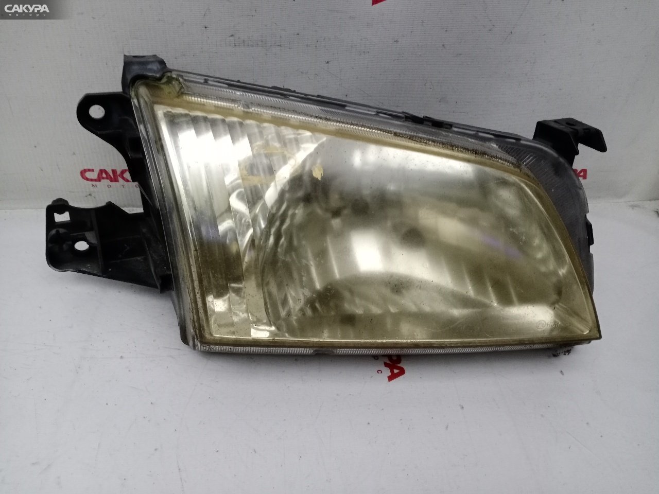 Фара правая Mazda Demio DW3W B3E P1001: купить в Сакура Красноярск.