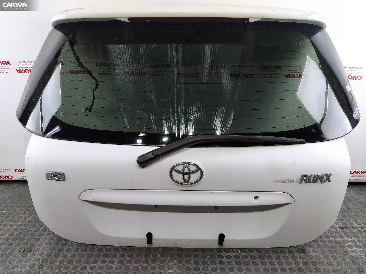 Дверь багажника Toyota Corolla Runx NZE124 1NZ-FE: купить в Сакура Красноярск.