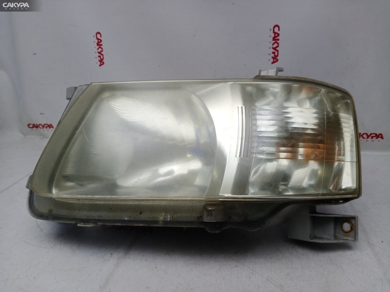 Фара левая Toyota Succeed NCP51V 1NZ-FE 52-076: купить в Сакура Красноярск.