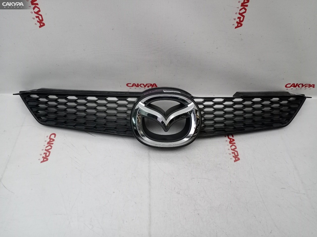 Решетка радиатора Mazda Demio DY3W ZJ-VE: купить в Сакура Красноярск.