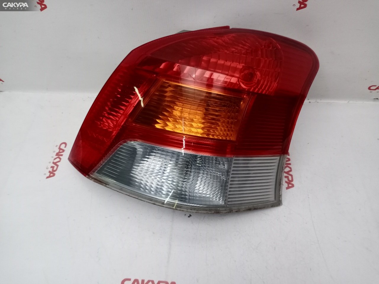 Фонарь стоп-сигнала правый Toyota Vitz SCP90 2SZ-FE 52-185: купить в Сакура Красноярск.