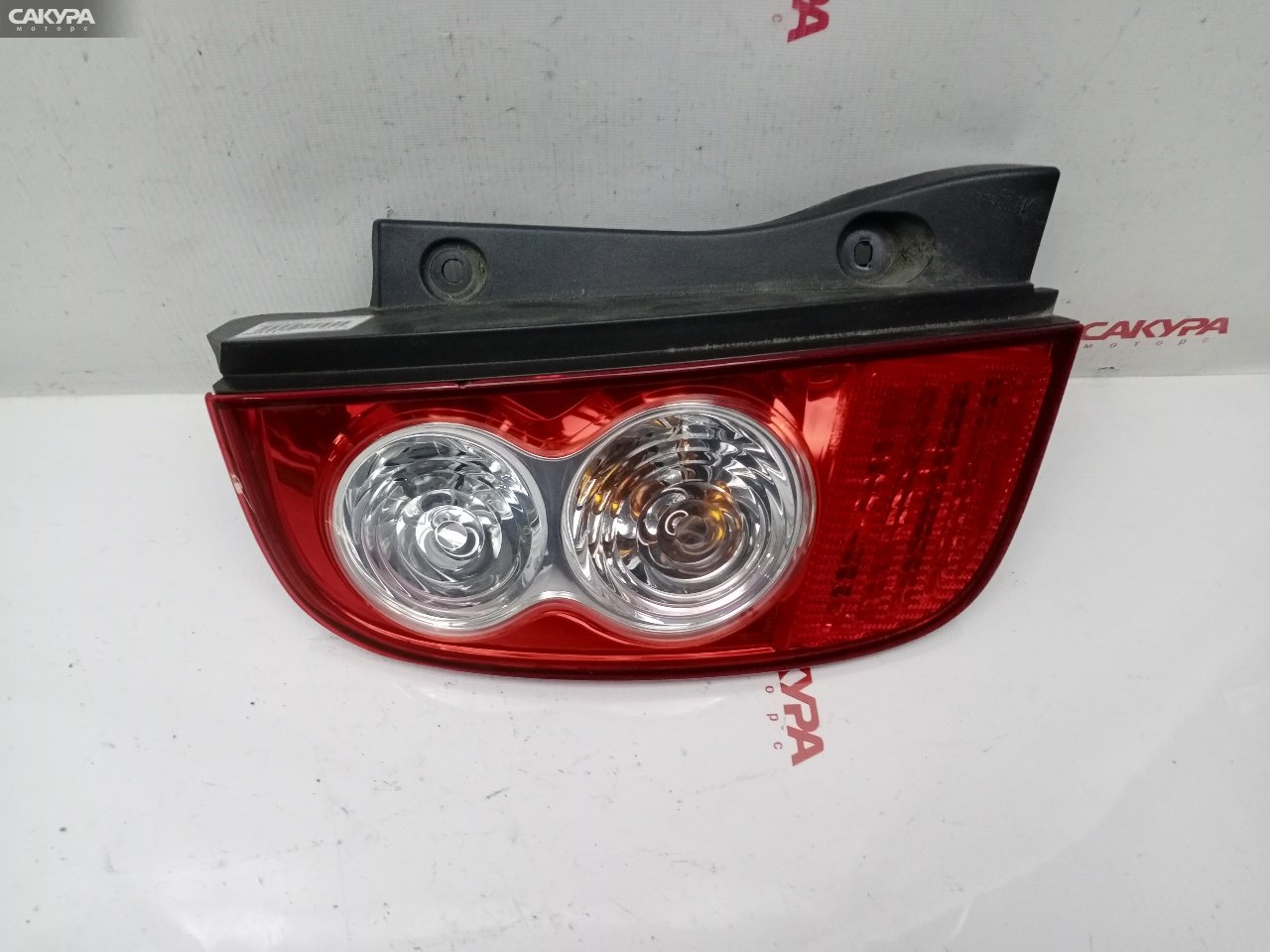 Фонарь стоп-сигнала левый Nissan March AK12 CR12DE D019: купить в Сакура Красноярск.