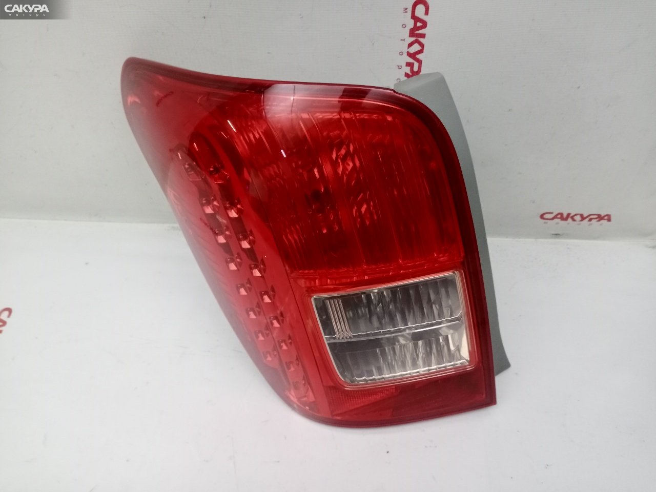 Фонарь стоп-сигнала левый Toyota Corolla Fielder NZE141G 1NZ-FE 13-97: купить в Сакура Красноярск.
