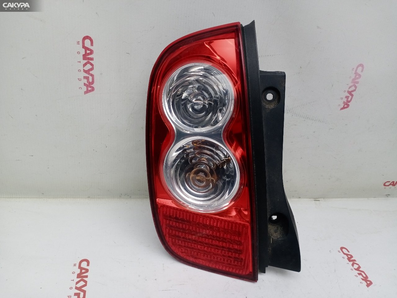 Фонарь стоп-сигнала левый Nissan March AK12 CR12DE D019: купить в Сакура Красноярск.