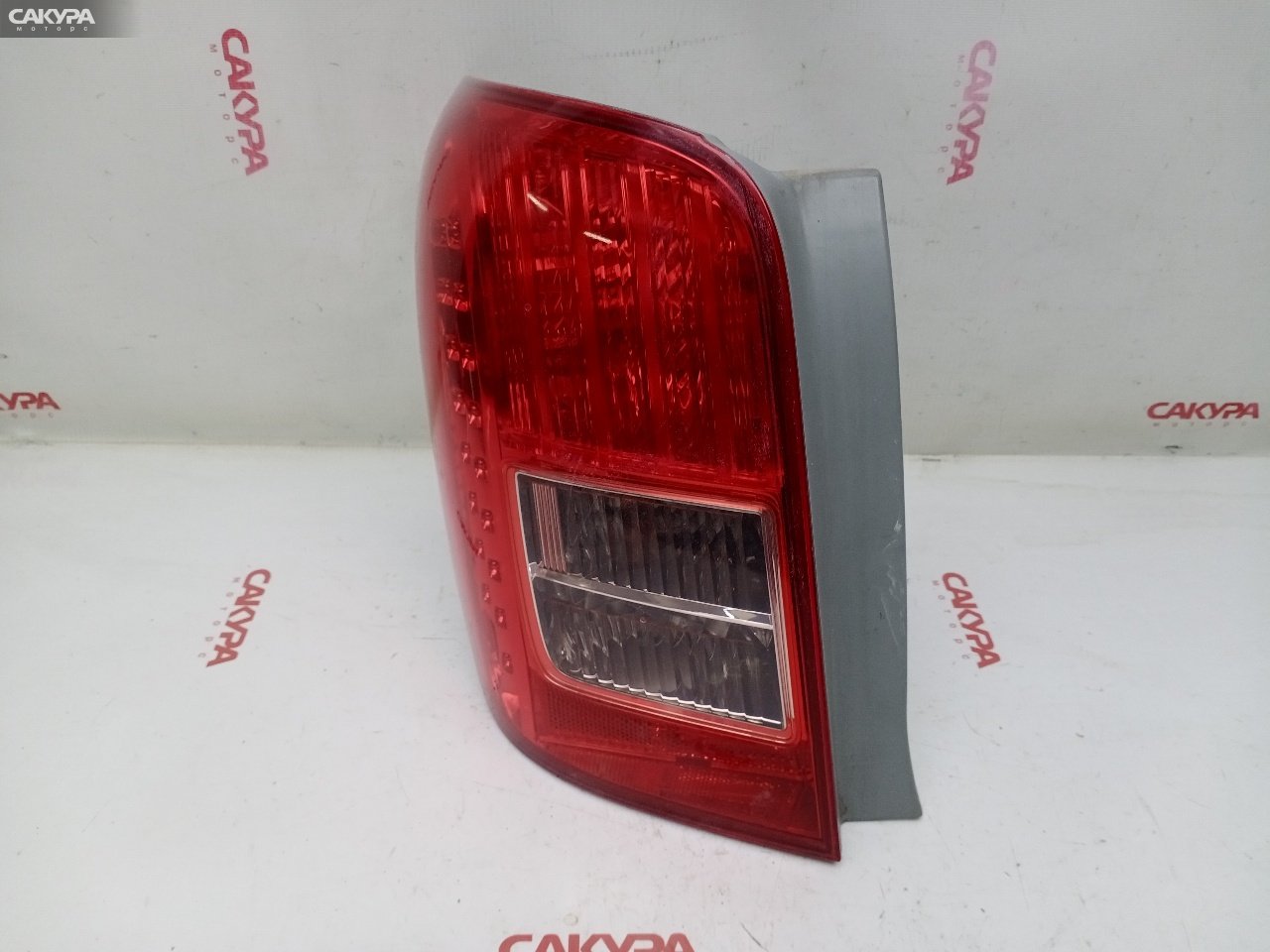 Фонарь стоп-сигнала левый Toyota Corolla Fielder NZE141G 1NZ-FE 13-97: купить в Сакура Красноярск.