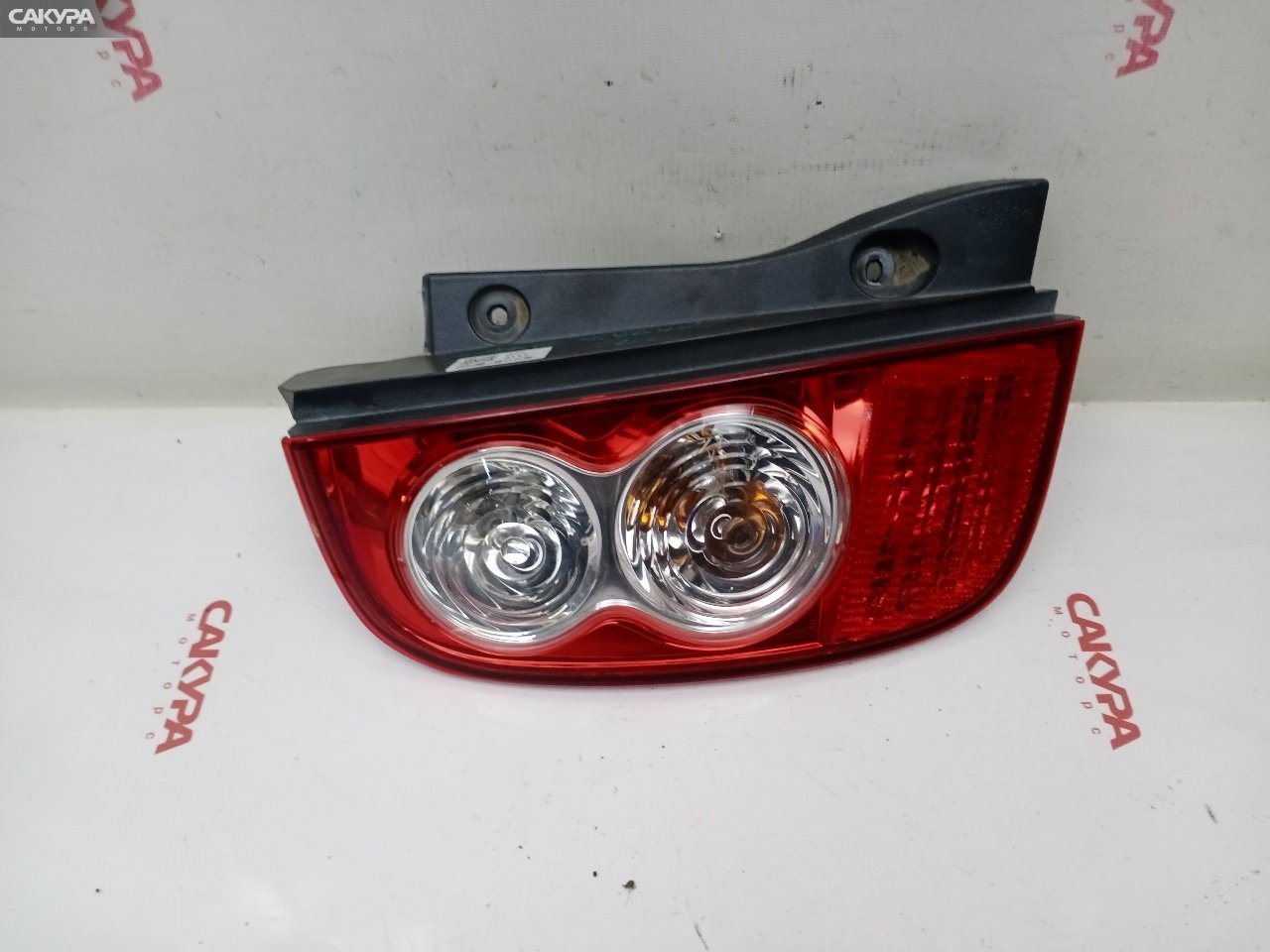 Фонарь стоп-сигнала левый Nissan March AK12 CR12DE D019: купить в Сакура Красноярск.