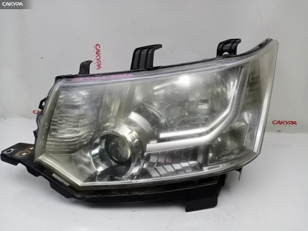 Фара левая Mitsubishi Delica D:5 CV4W 4B11 100-87918: купить в Сакура Красноярск.
