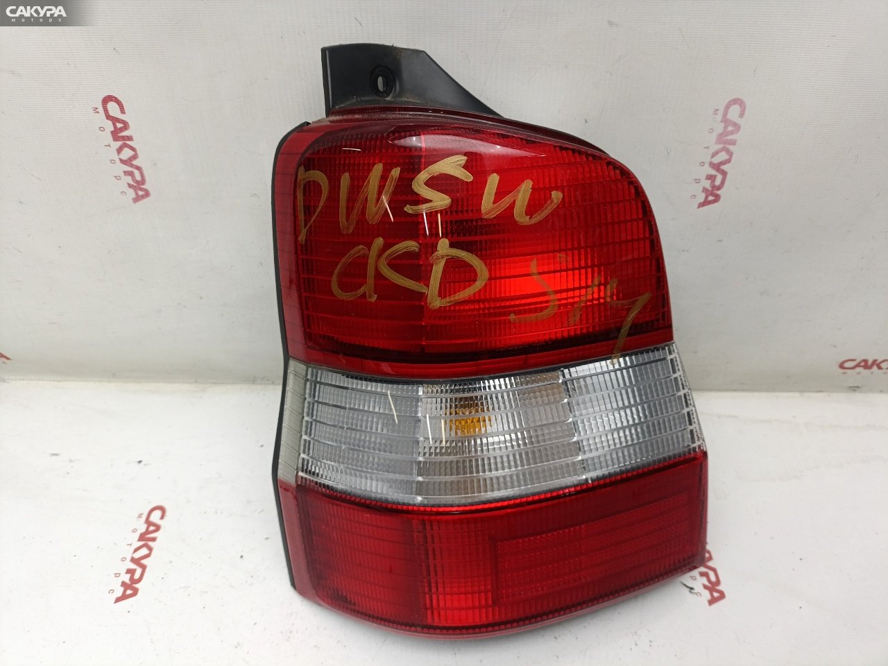 Фонарь стоп-сигнала левый Mazda Demio DW5W B5-ME 4781: купить в Сакура Красноярск.