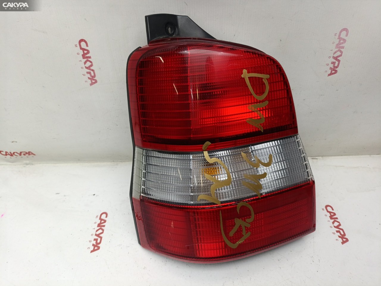 Фонарь стоп-сигнала левый Mazda Demio DW3W B3-ME 4781: купить в Сакура Красноярск.