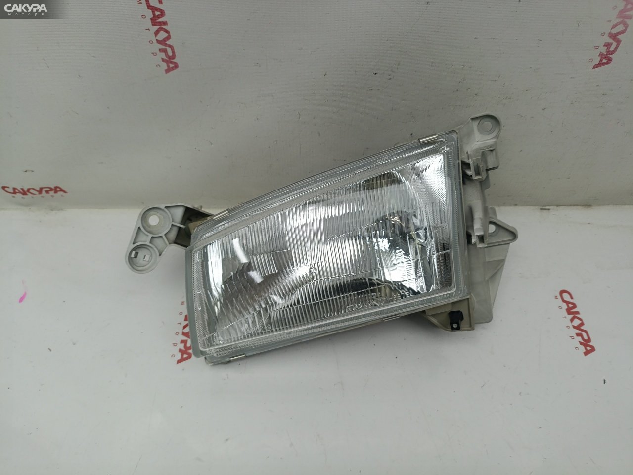 Фара левая Mazda Demio DW3W B3-ME 001-6872: купить в Сакура Красноярск.