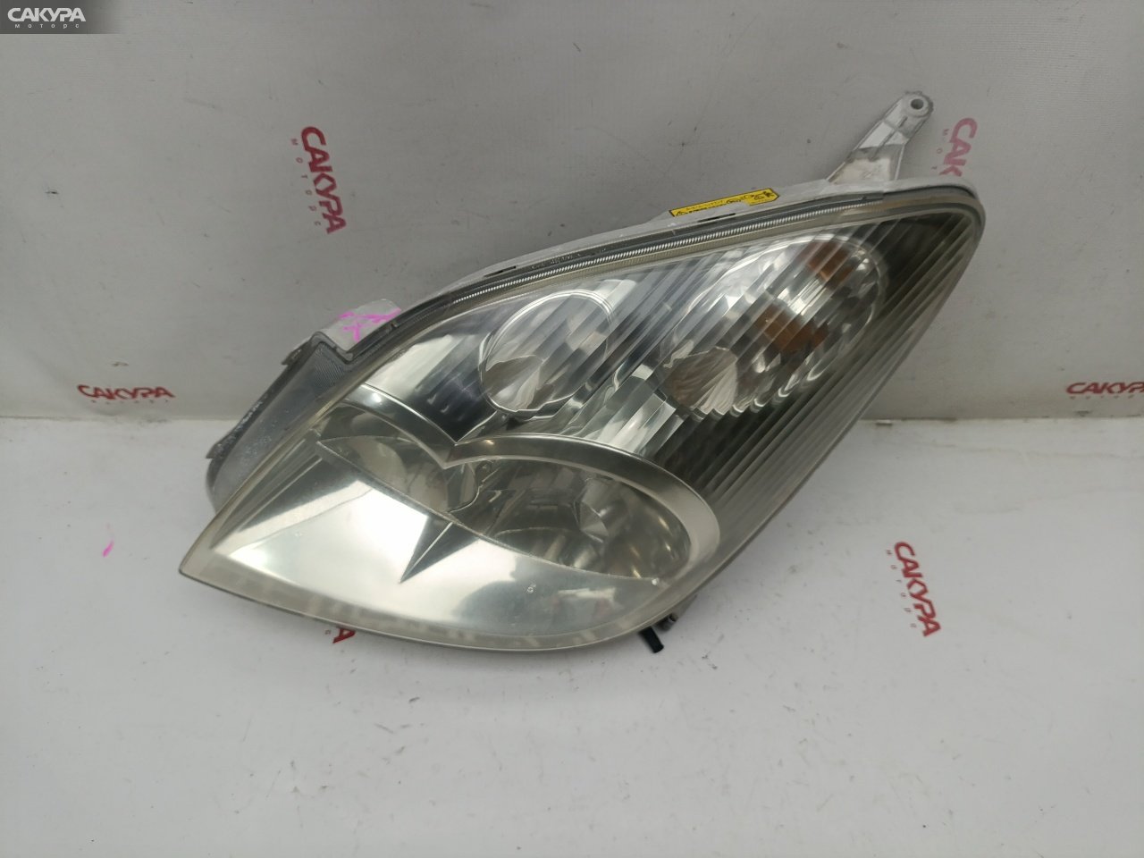 Фара левая Toyota Corolla Spacio NZE121N 1NZ-FE 13-73: купить в Сакура Красноярск.
