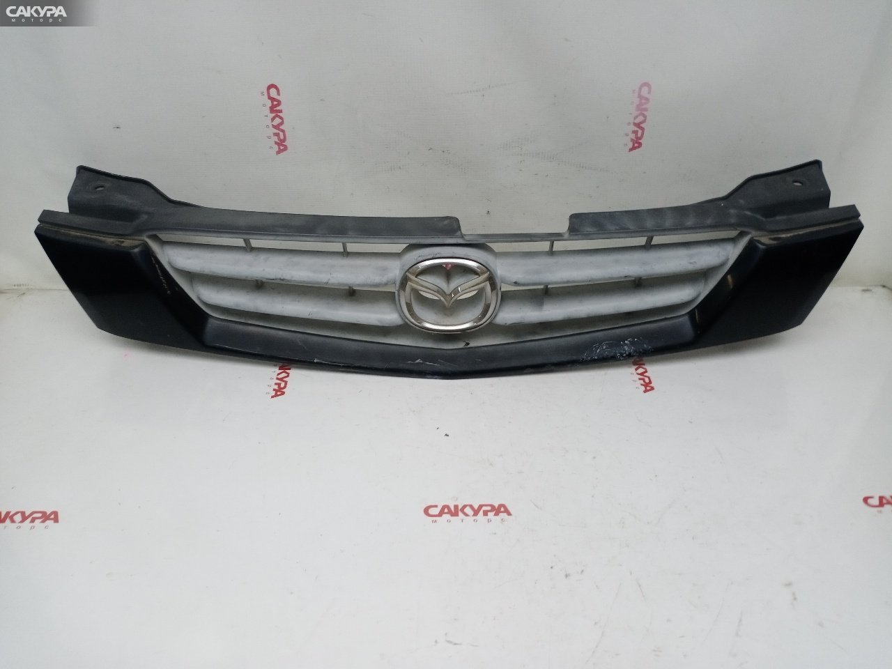 Решетка радиатора Mazda Demio DW5W B5-E: купить в Сакура Красноярск.