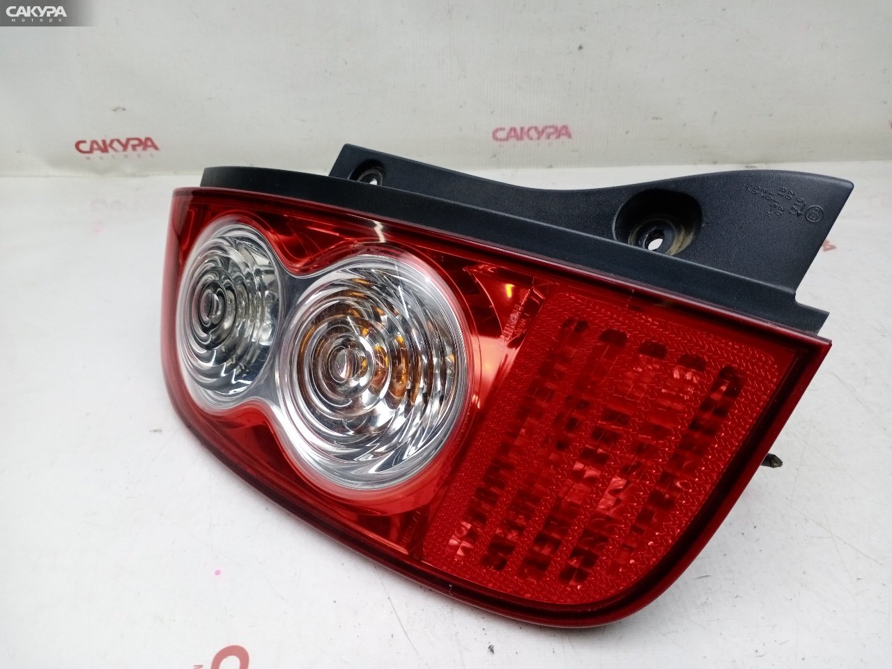 Фонарь стоп-сигнала левый Nissan March AK12 CR12DE D019: купить в Сакура Красноярск.