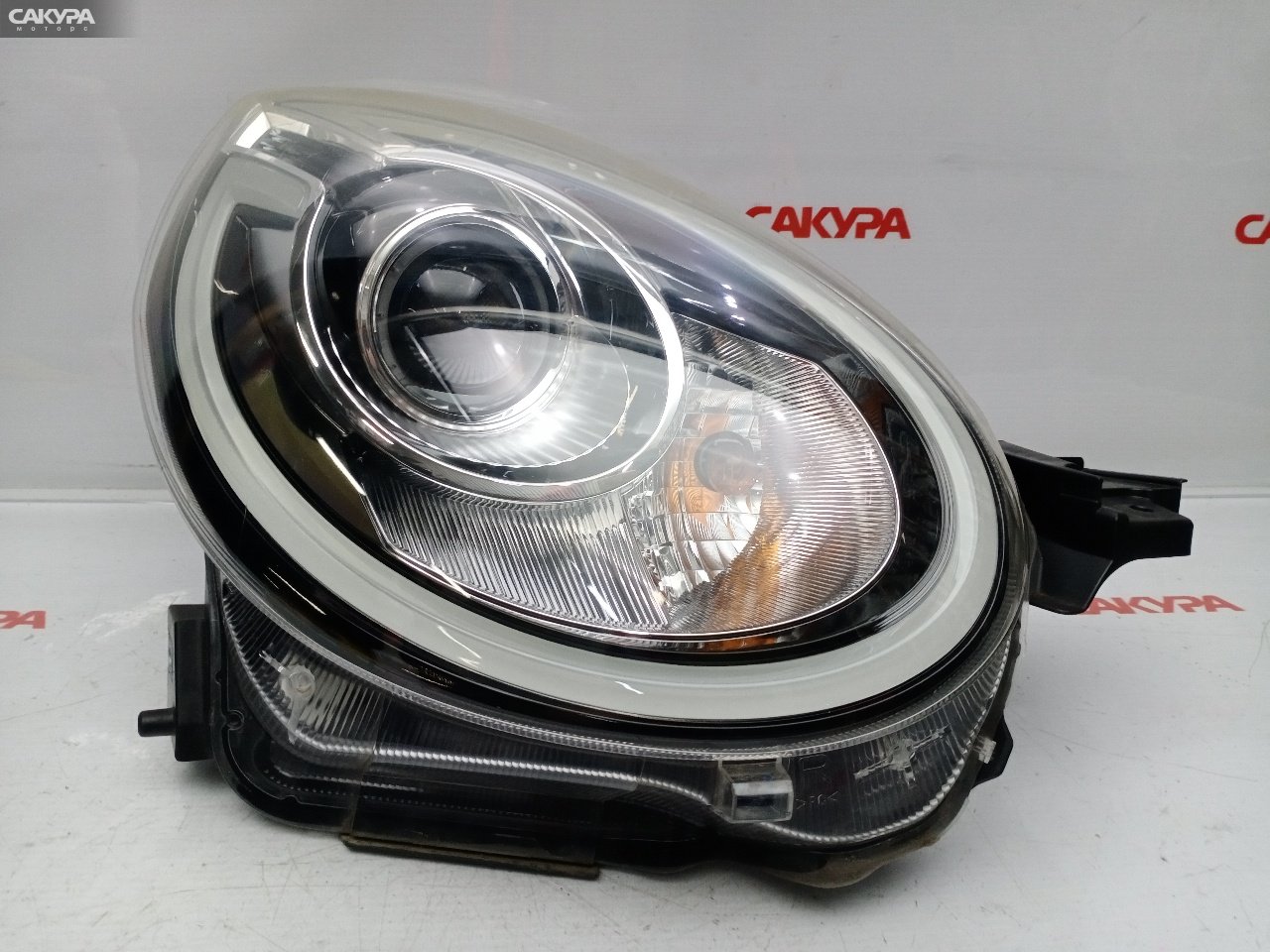 Фара правая Daihatsu Boon M700S 1KR-FE 100-69028: купить в Сакура Красноярск.