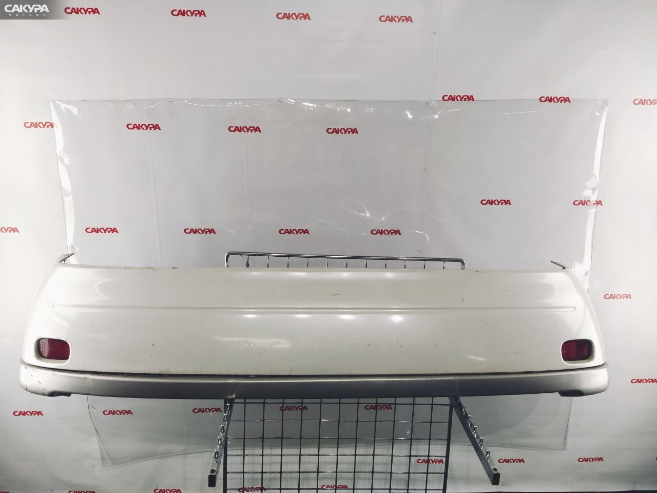 Бампер задний Toyota Raum EXZ10 5E-FE: купить в Сакура Красноярск.