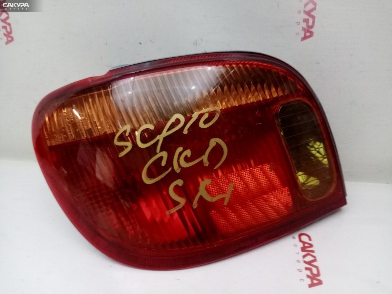 Фонарь стоп-сигнала левый Toyota Vitz SCP10 1SZ-FE 52-049: купить в Сакура Красноярск.