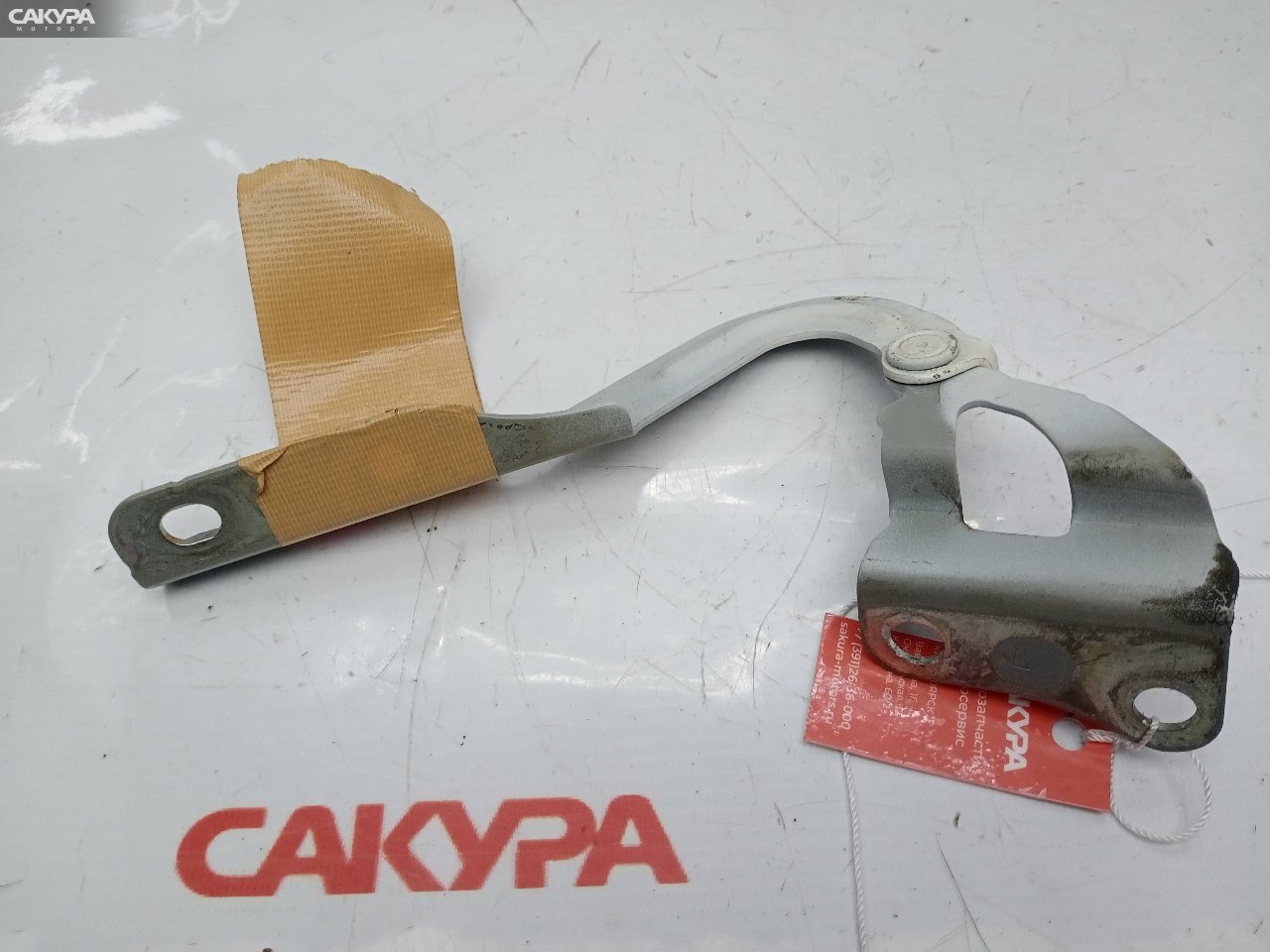 Кронштейн капота левый Daihatsu Mira L275V KF-VE: купить в Сакура Красноярск.