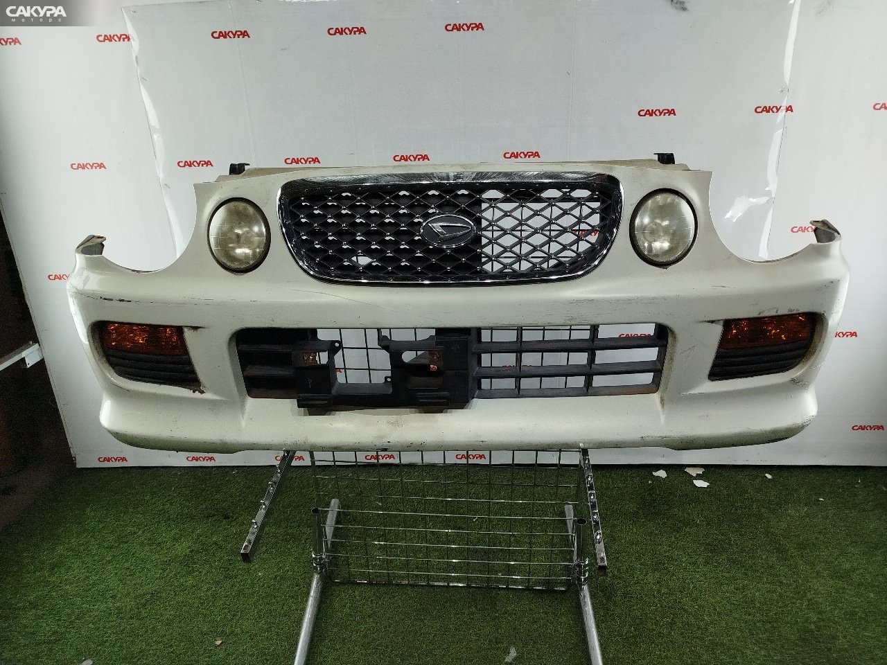 Бампер передний Daihatsu Opti L810S EF-VE: купить в Сакура Красноярск.