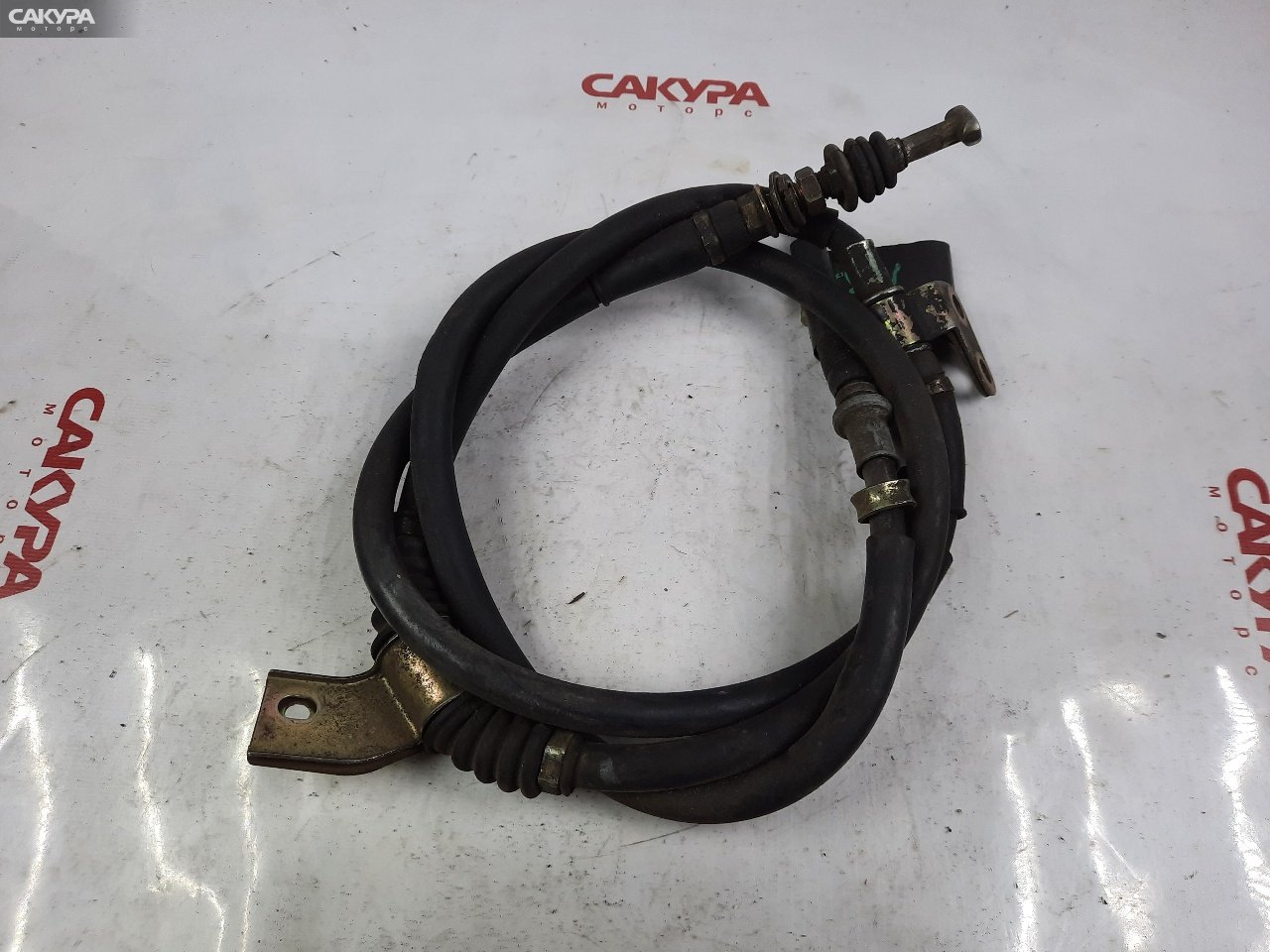 Трос ручника правый Mazda Capella GV8W: купить в Сакура Красноярск.