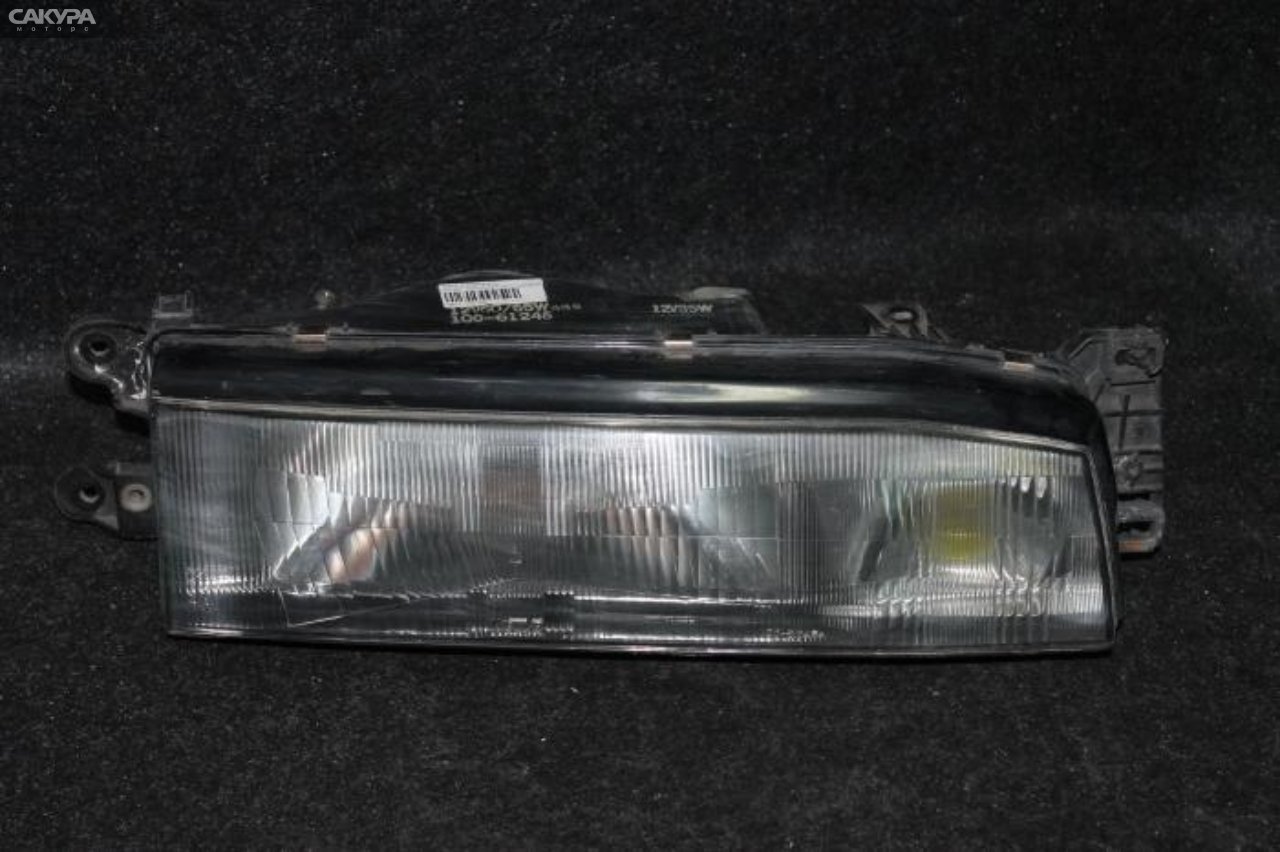 Фара правая Mazda Familia BF5P 100-61246: купить в Сакура Красноярск.