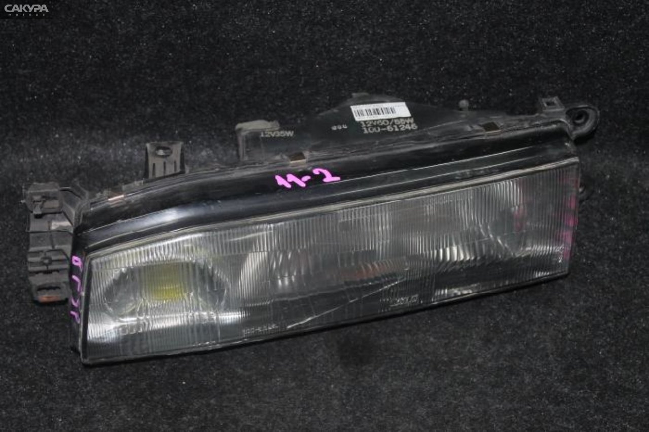 Фара левая Mazda Familia BF5P 100-61246: купить в Сакура Красноярск.