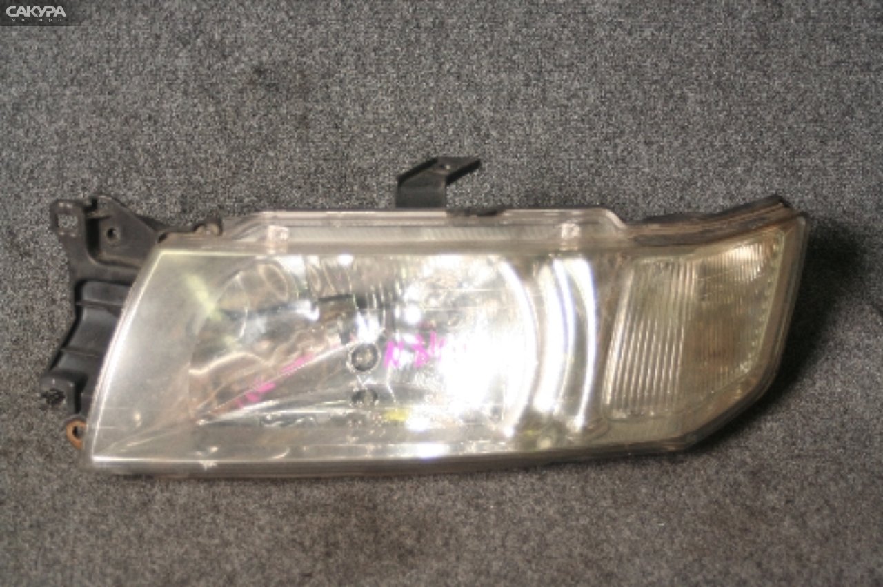 Фара левая Mitsubishi Chariot Grandis N84W 100-87476: купить в Сакура Красноярск.