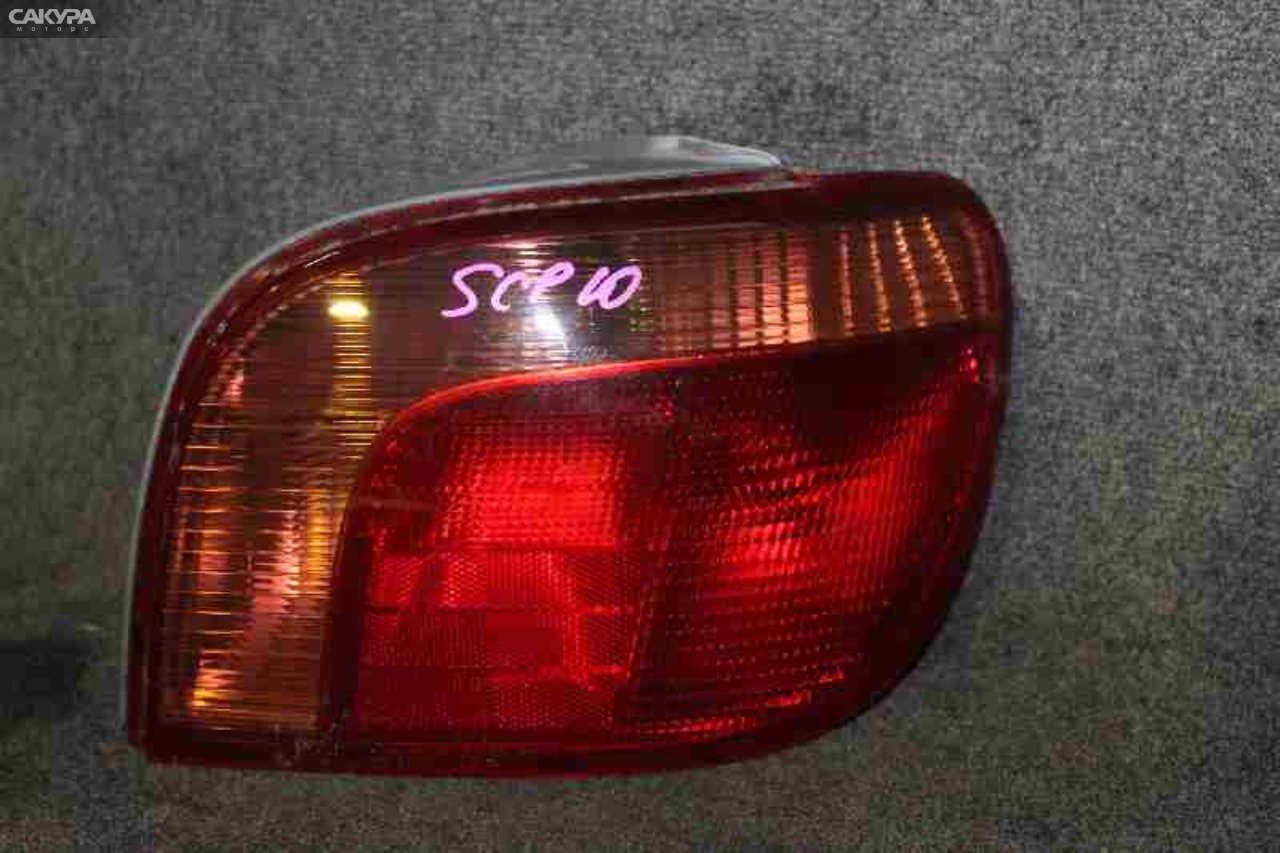 Фонарь стоп-сигнала правый Toyota Vitz SCP13 2SZ-FE 52-041: купить в Сакура Красноярск.