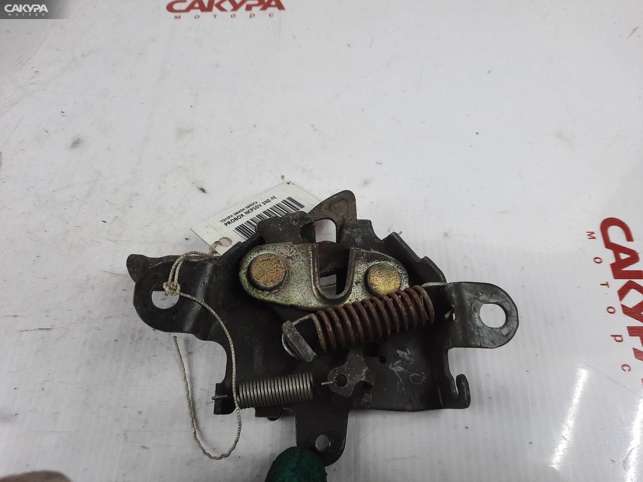 Замок капота Toyota Probox NCP50V 2NZ-FE: купить в Сакура Красноярск.