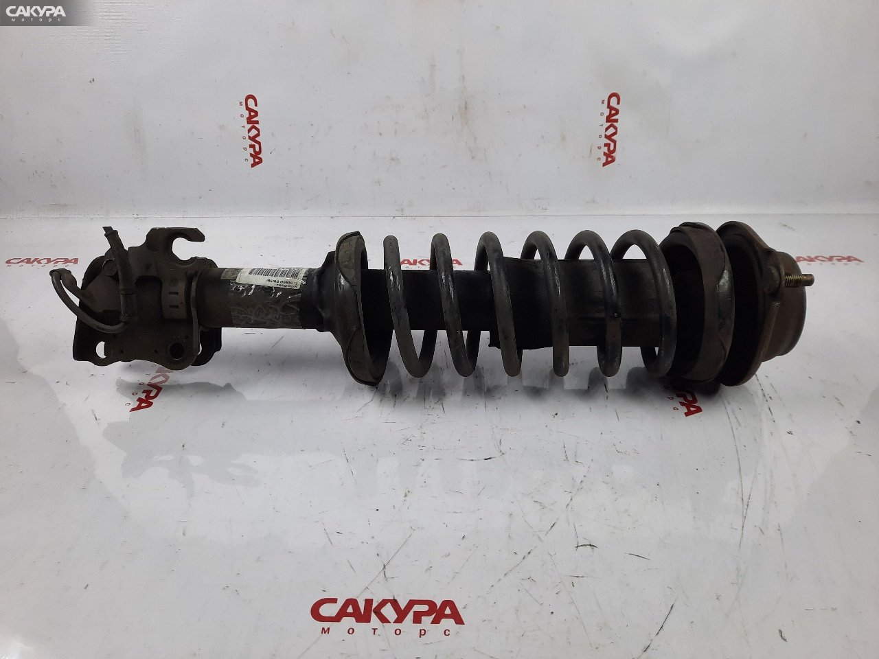 Стойка подвески передняя левая Mazda Demio DW3W B3-ME: купить в Сакура Красноярск.