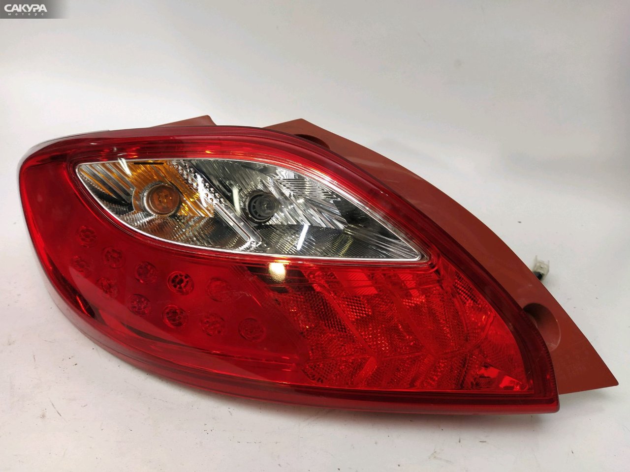 Фонарь стоп-сигнала левый Mazda Demio DE3FS P5776: купить в Сакура Красноярск.