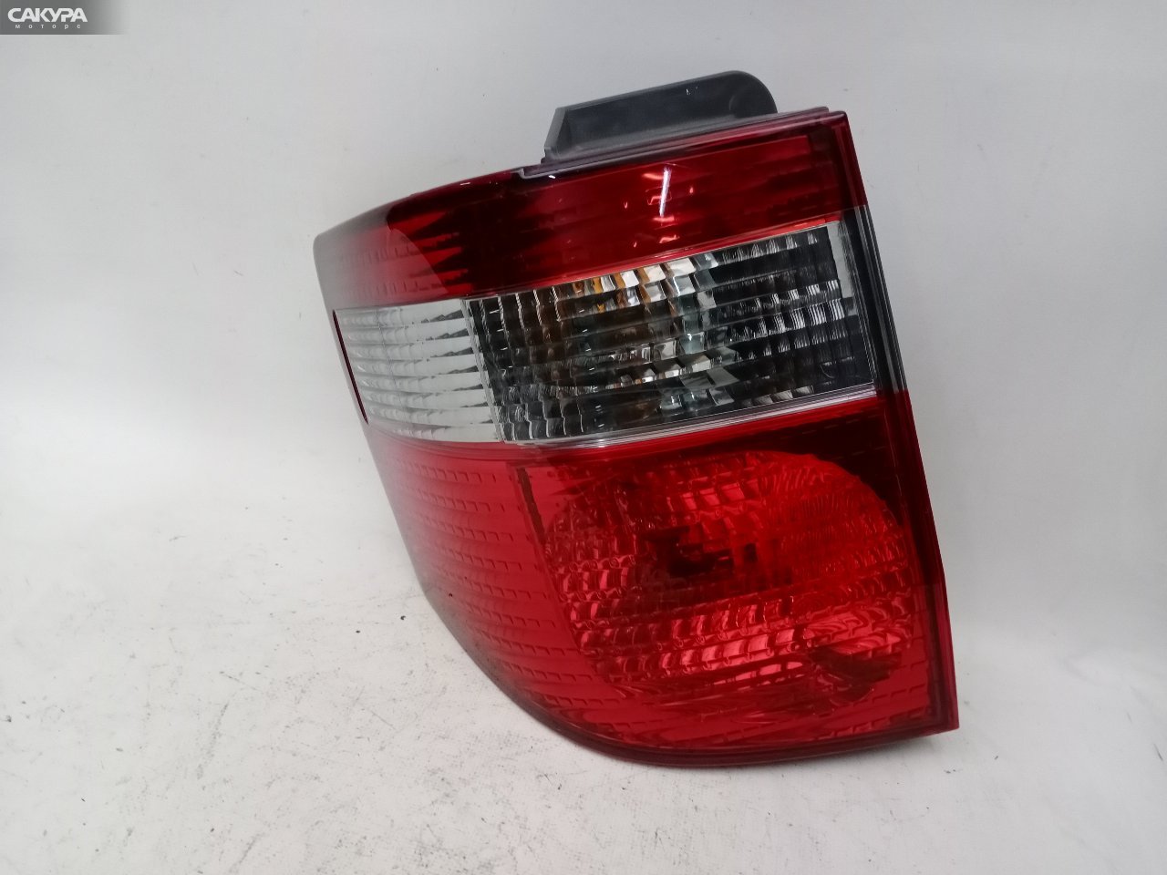 Фонарь стоп-сигнала левый Toyota Alphard ANH10W 58-5: купить в Сакура Красноярск.