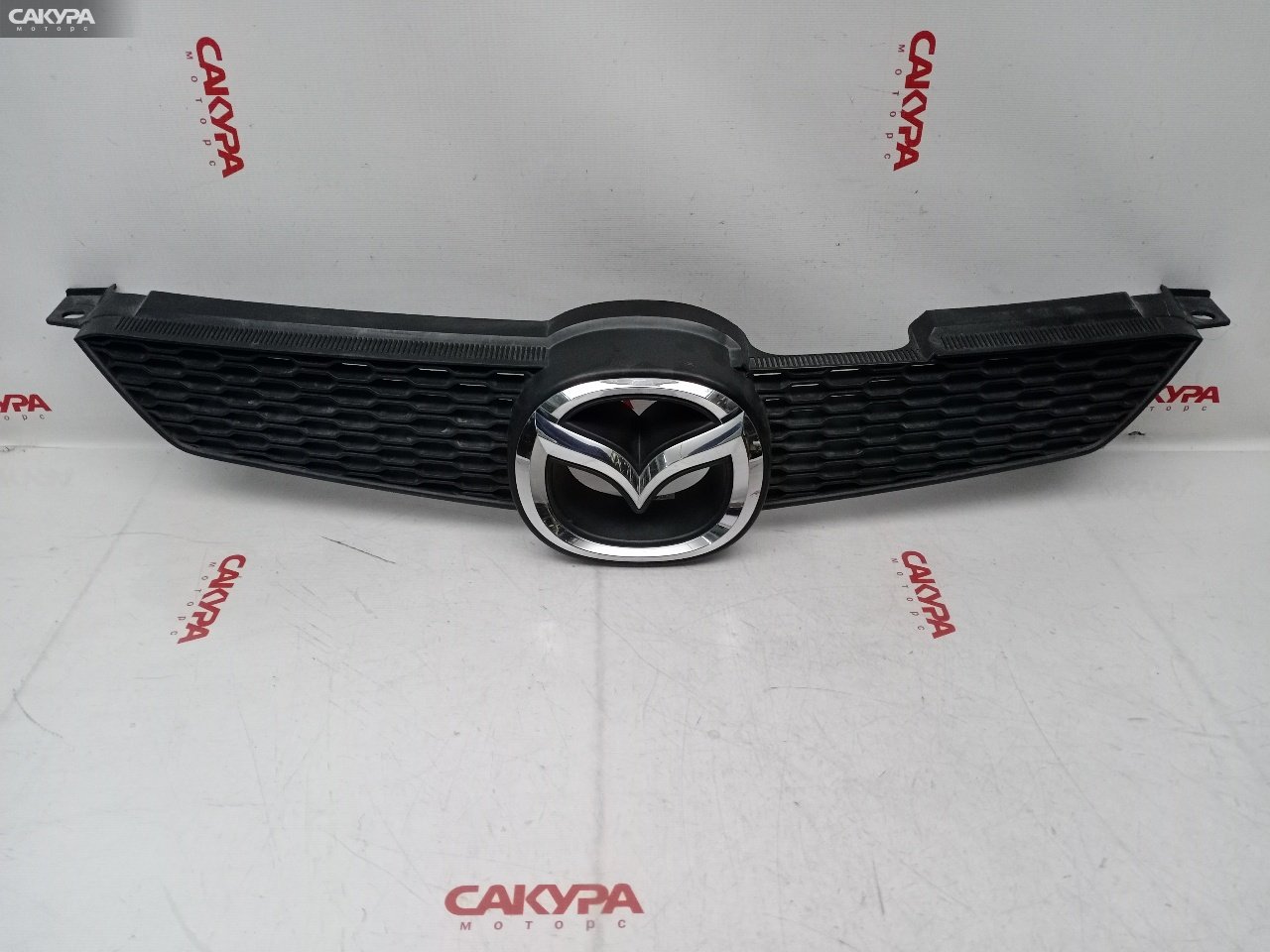 Решетка радиатора Mazda Demio DY3W ZJ-VE: купить в Сакура Красноярск.