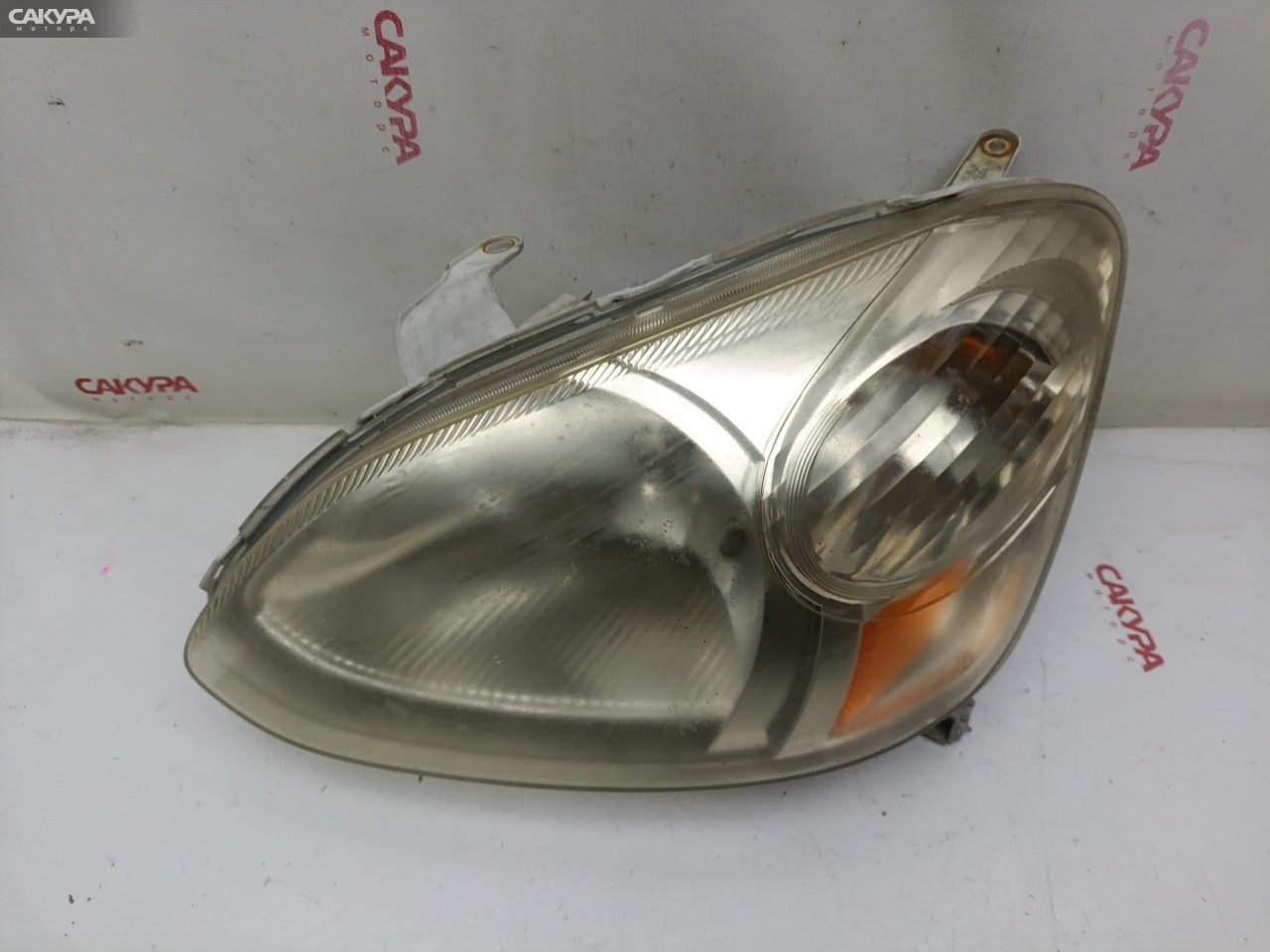 Фара левая Toyota Platz NCP16 2NZ-FE 52-067: купить в Сакура Красноярск.