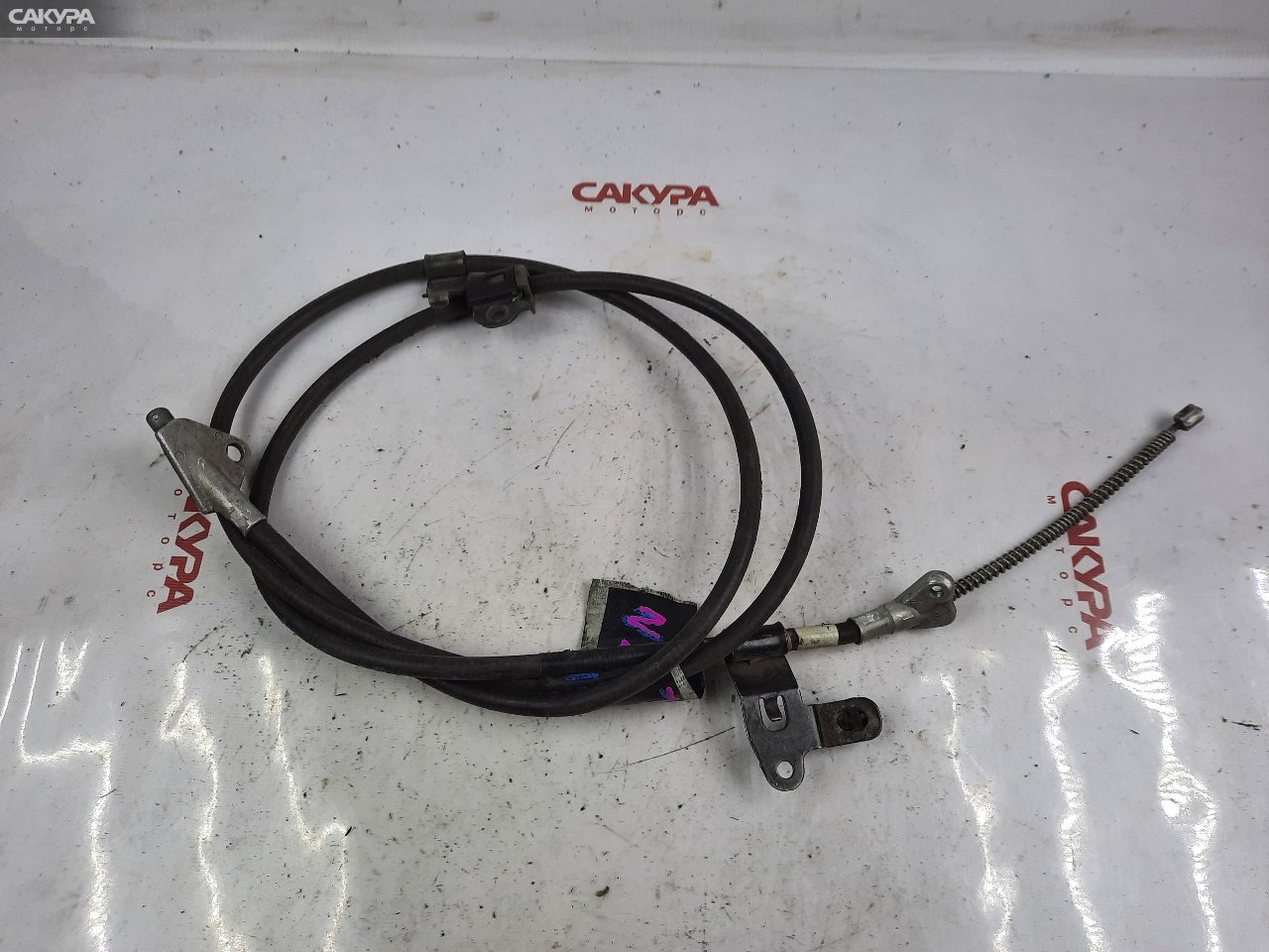 Трос ручника левый Toyota Allex NZE121 1NZ-FE: купить в Сакура Красноярск.