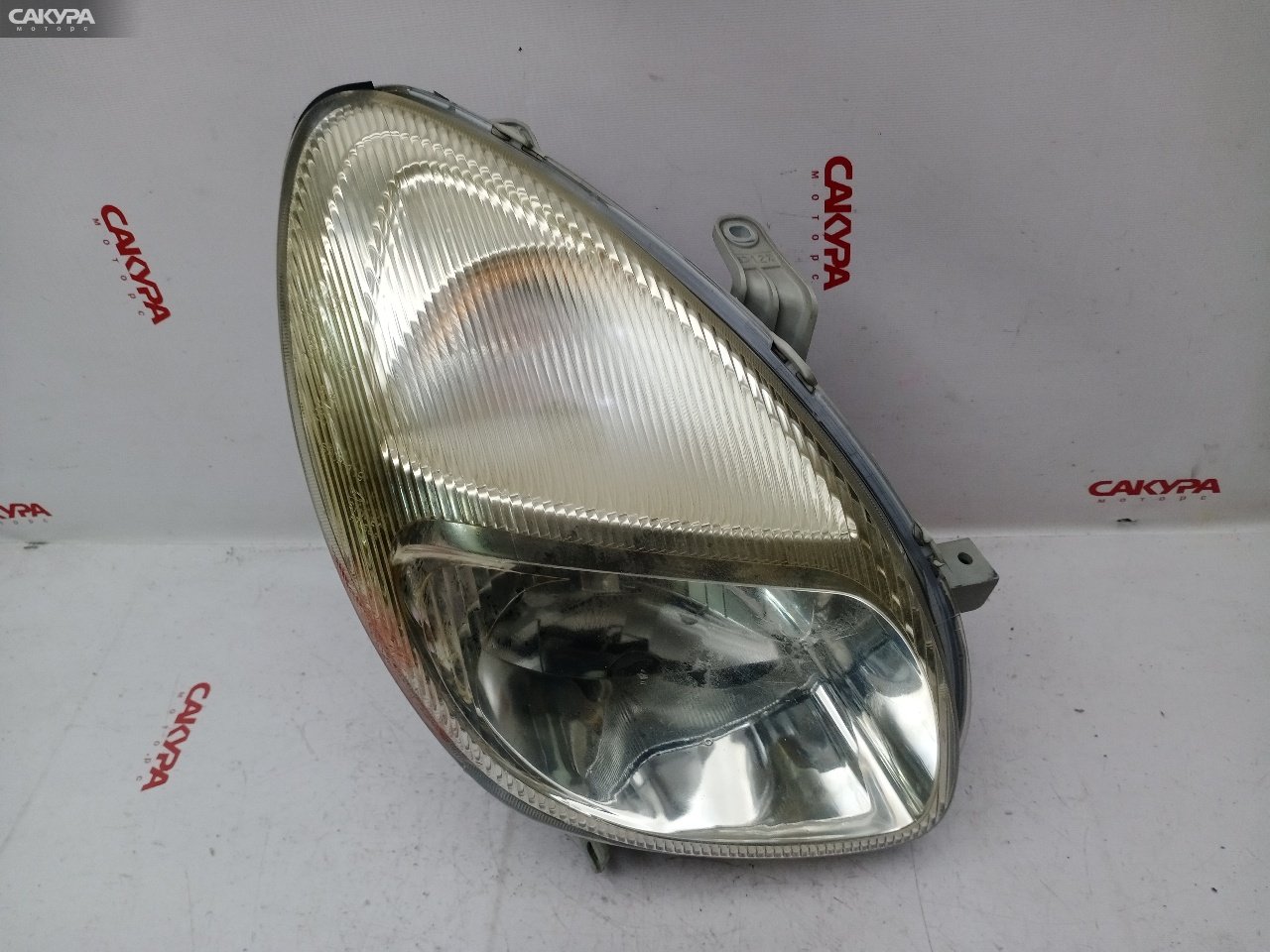 Фара правая Toyota Duet M100A EJ-VE R7368: купить в Сакура Красноярск.