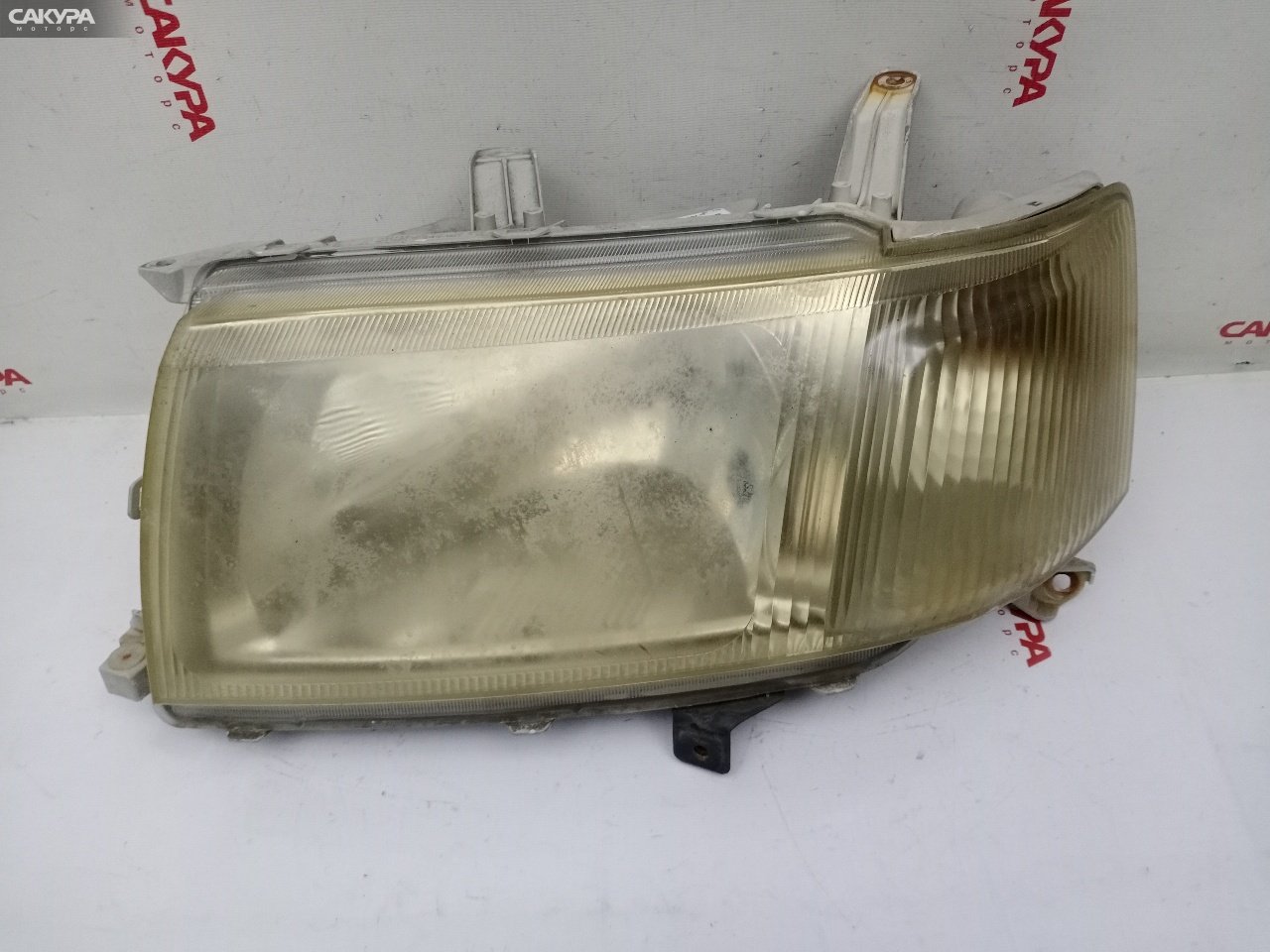 Фара левая Toyota Probox NCP50V 2NZ-FE 52-075: купить в Сакура Красноярск.