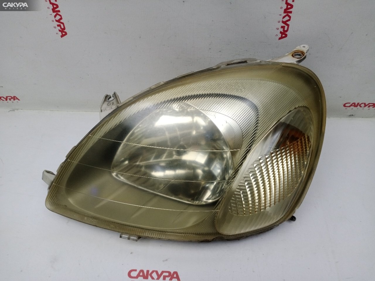 Фара левая Toyota Vitz SCP10 1SZ-FE 52-001: купить в Сакура Красноярск.