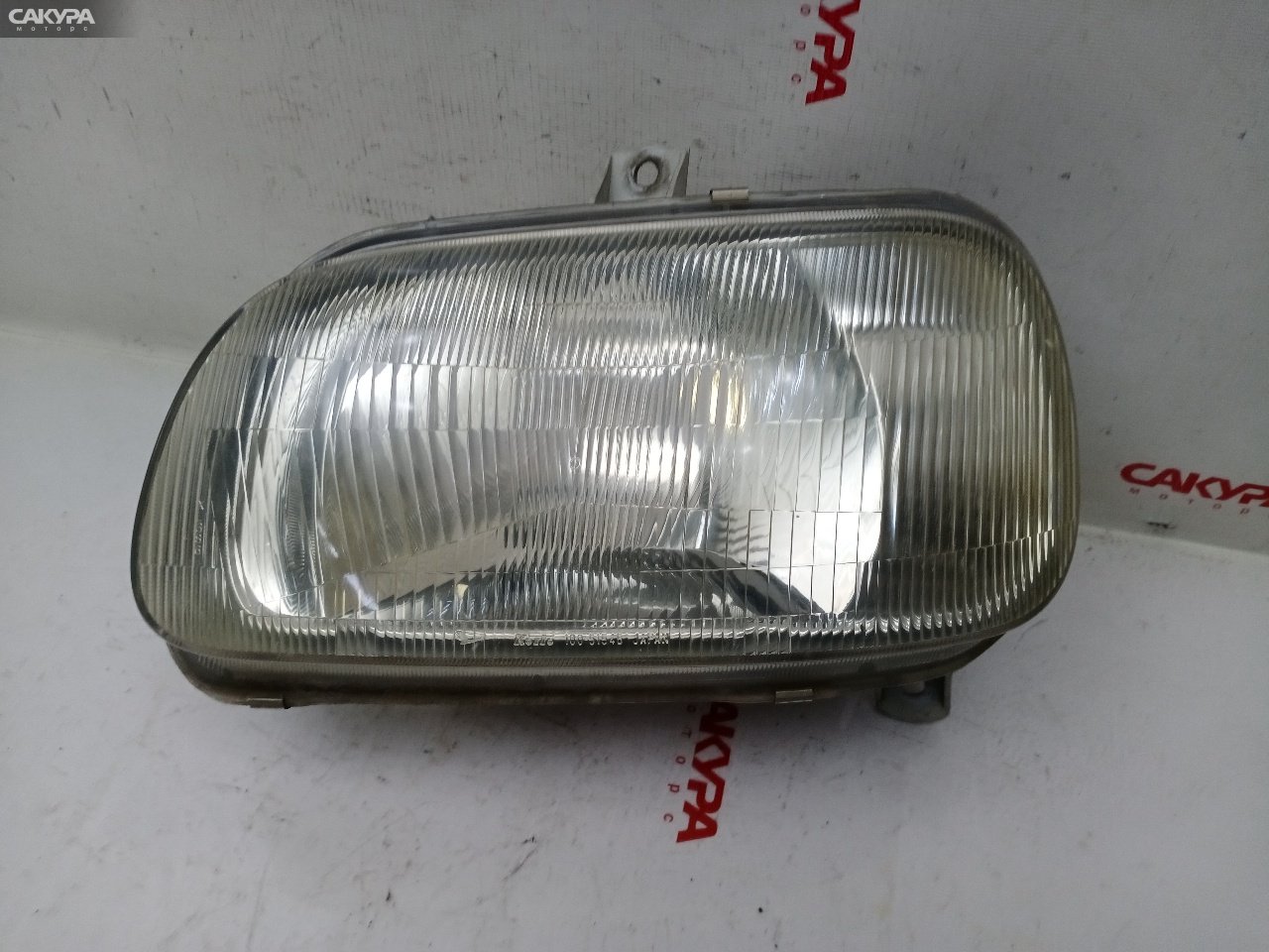 Фара левая Daihatsu Mira L500V EF-CL 100-51545: купить в Сакура Красноярск.