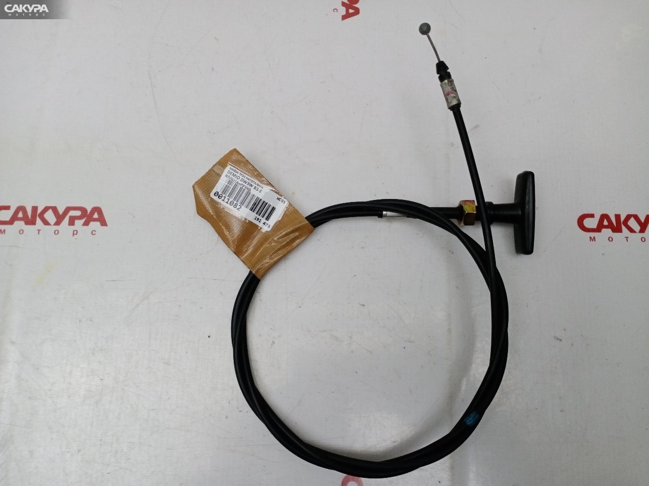 Трос капота Mazda Demio DW3W B3E: купить в Сакура Красноярск.