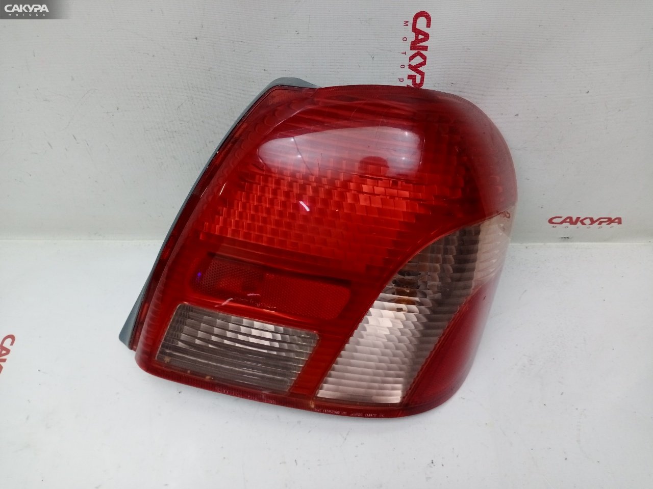 Фонарь стоп-сигнала правый Toyota Platz NCP12 1NZ-FE 52-013: купить в Сакура Красноярск.