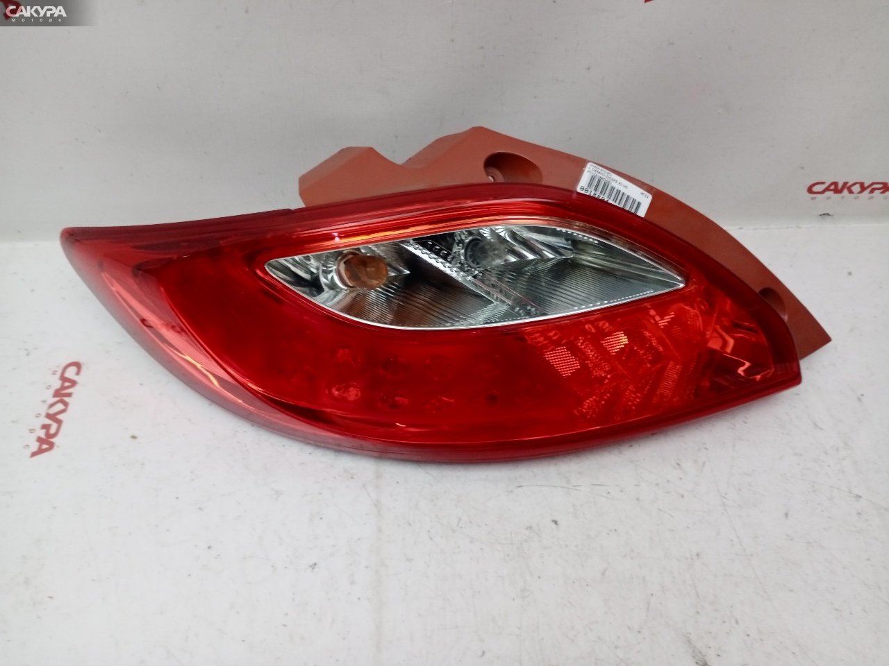 Фонарь стоп-сигнала левый Mazda Demio DE3FS ZJ-VE P5776: купить в Сакура Красноярск.