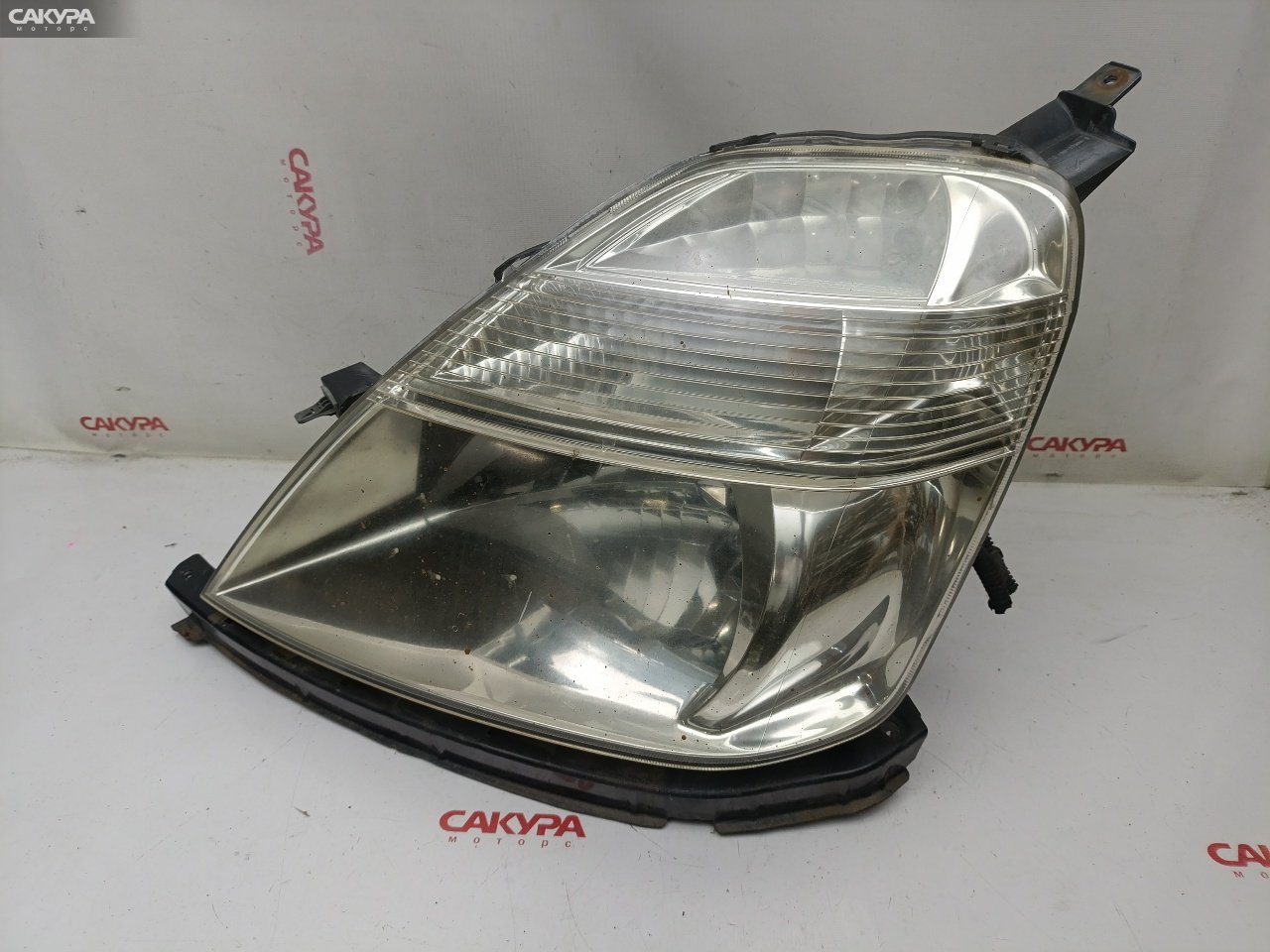 Фара левая Honda Stream RN1 D17A 100-22360: купить в Сакура Красноярск.