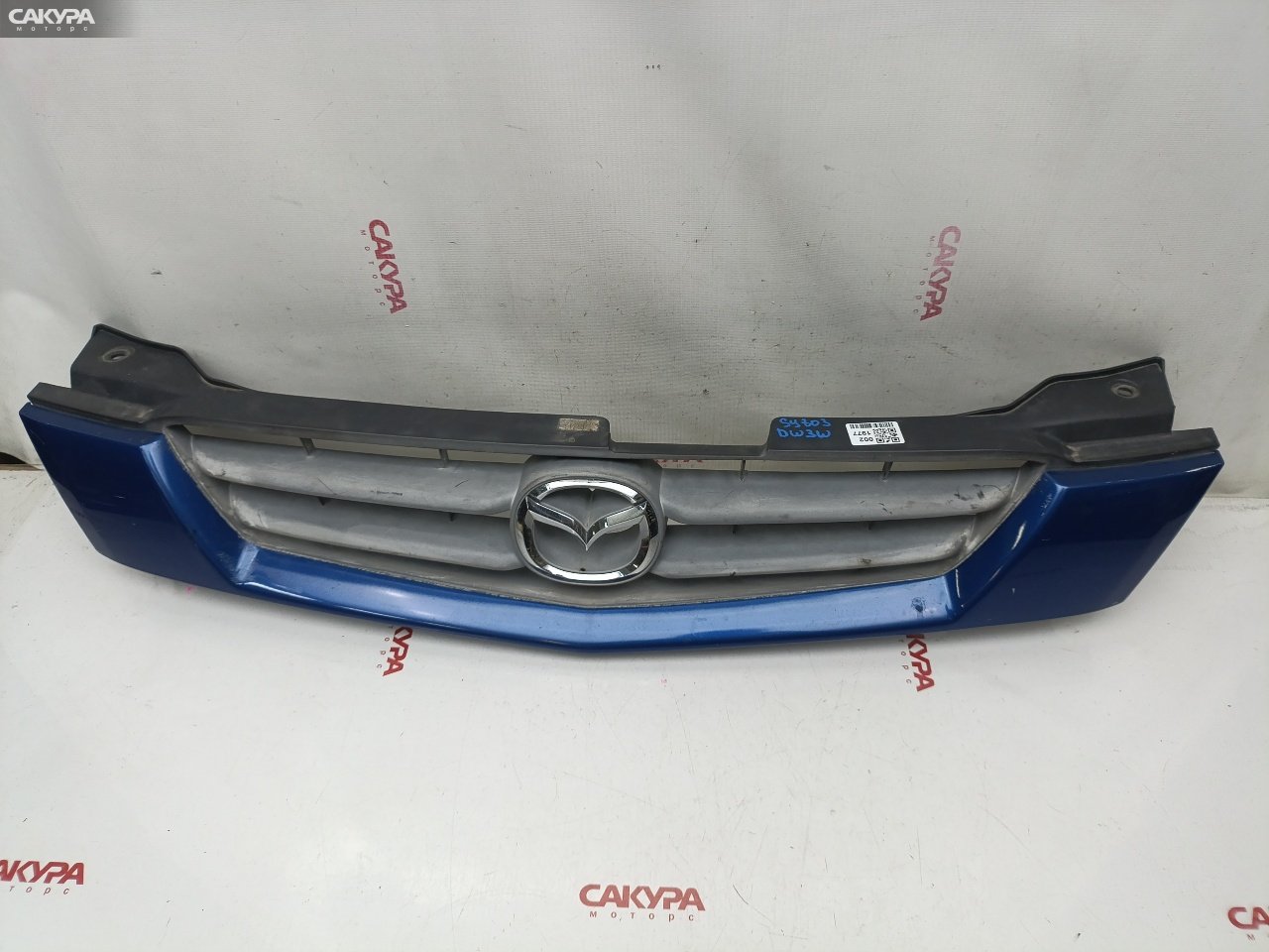 Решетка радиатора Mazda Demio DW3W B3E: купить в Сакура Красноярск.