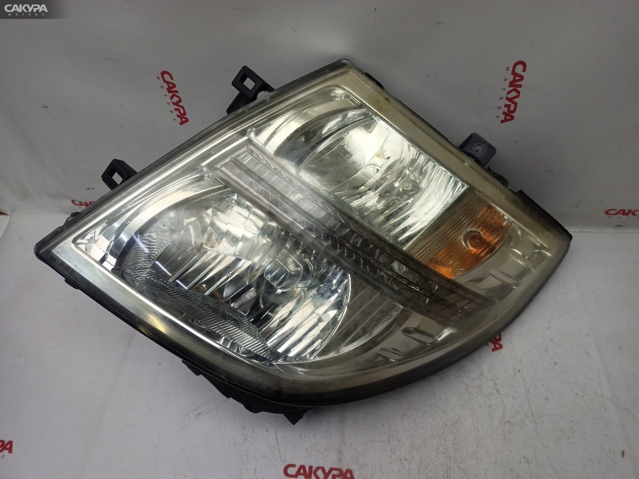 Фара левая Nissan Elgrand E51 VQ35DE 100-24854: купить в Сакура Красноярск.