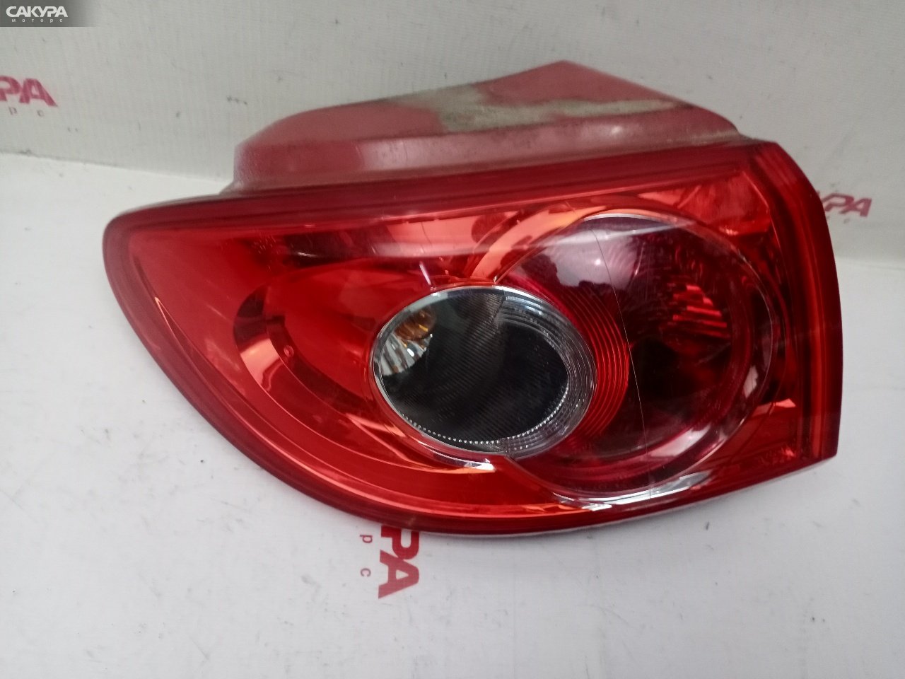 Фонарь стоп-сигнала левый Mazda Demio DY3W ZJ-VE P4419: купить в Сакура Красноярск.